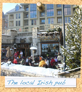 In the courtyard Whistler's Irish pub there is snow on the trees.